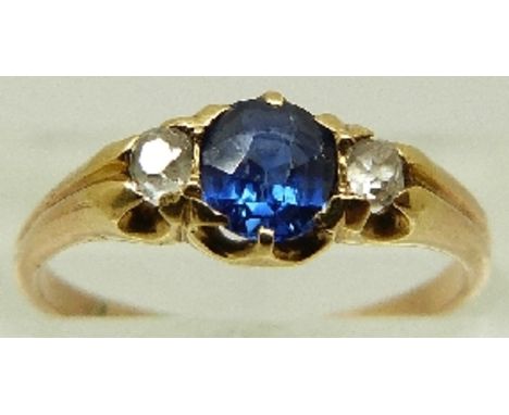 A Victorian ring set with a sapphire and two old cut diamonds, size J/K, 2.1g 