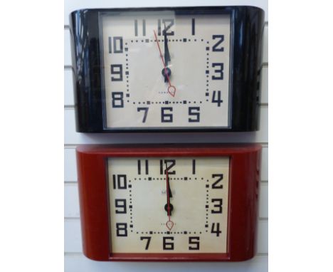 Two Newgate quartz 'Metro' clocks in Deco style case, one in red the other black, with stylised Arabic numerals and red secon