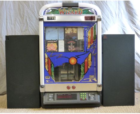 The Wizard NSM c1980s CD juke box with light up surround to the arch front, 100cm tall, 60cm wide, 35cm deep, together with a