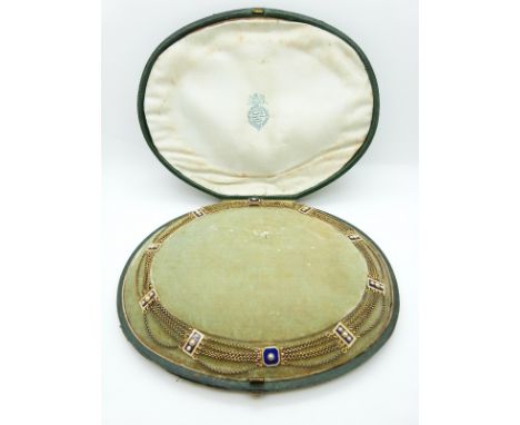 A late Victorian metamorphic necklace/ two bracelets of 10 panels joined by a five strand chain, each panel set with blue gui