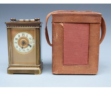 Brass cased carriage clock, c1910, with corniche-style case, 42mm ivory coloured Arabic chapter ring, blue steel spade hands,