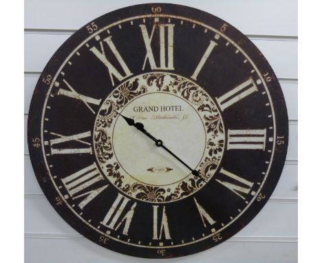 A caseless quartz wall clock with black Roman chapter ring, the distressed effect dial marked Grand Hotel, Rue Montmartre 58,