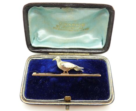 A 15ct gold brooch set with enamel and abalone/ mother of pearl in the form of a pigeon, in original box