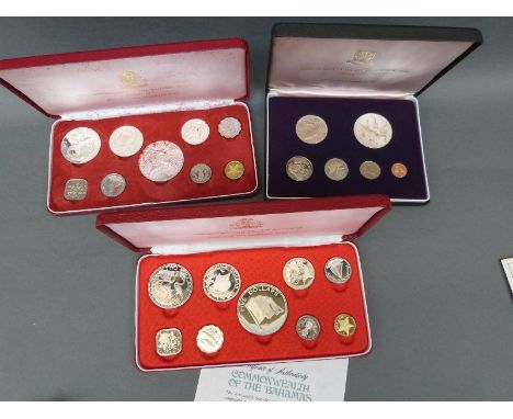 Three cased proof coin sets comprising First Coinage of the British Virgin Islands and two Commonwealth of the Bahamas sets