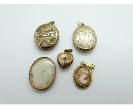 A Victorian locket with chased foliate design to both sides, a Victorian locket set with an enamel section, verso chased deco