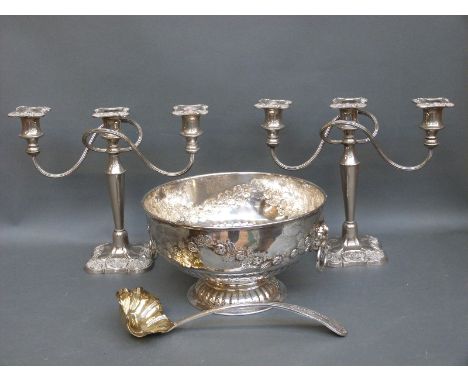 A silver plated punch bowl diameter 27cm with ladle, and a pair of silver plated candelabra sticks