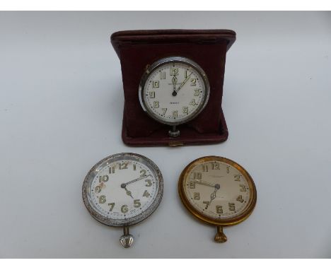 A cased 8 day Swiss travel clock, Wm Greenwood & Sons, Leeds and Huddersfield to Arabic luminous dial, together with two simi