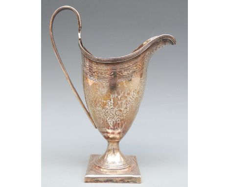 Georgian hallmarked silver helmet shaped pedestal cream jug with bright cut decoration and vacant shield cartouche, London 17