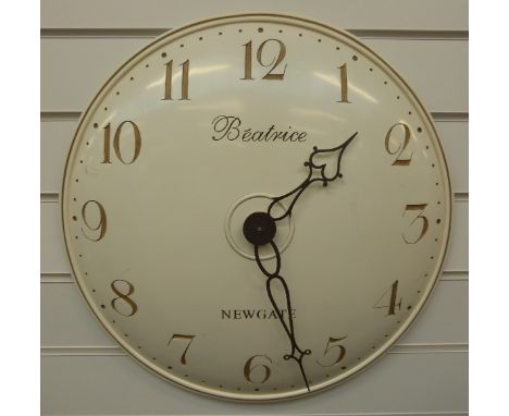 Newgate 'Beatrice' quartz caseless wall clock, the ivory coloured convex dial with contrasting gold coloured Arabic numerals,