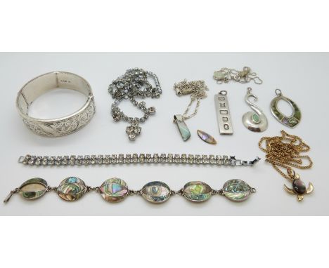 A collection of silver jewellery including a bangle, Chester 1957, boulder opal pendant, silver Mexican bracelet set with aba