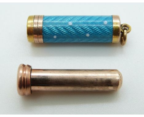 A 9ct gold charm set with aqua guilloché enamel revealing a propelling pencil, 7g 