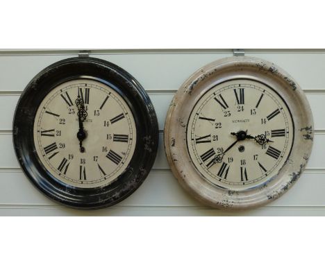 Newgate enamel quartz wall clock in black surround with Roman hours and Arabic 24 hours together with a further example in mu