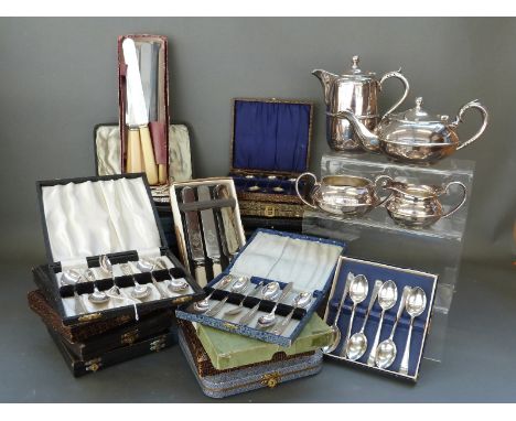 Twenty cased sets of silver plated teaspoons, cased nut set, cased knives and a plated tea set