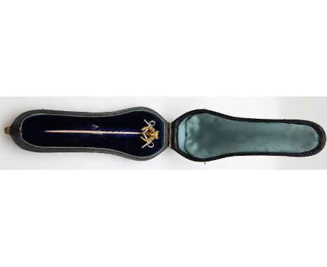 A Victorian stick pin in the form of a fox's head, horseshoe and snaffle bit, in original box 