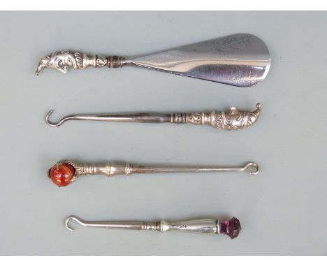 Edward VII hallmarked novelty silver-handled shoe horn and button hook, each with a Mr Punch handle, one Birmingham 1906 the 