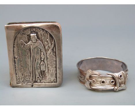 A hallmarked silver buckle napkin ring, Birmingham 1869, maker George Unite and a miniature book with hallmarked silver cover