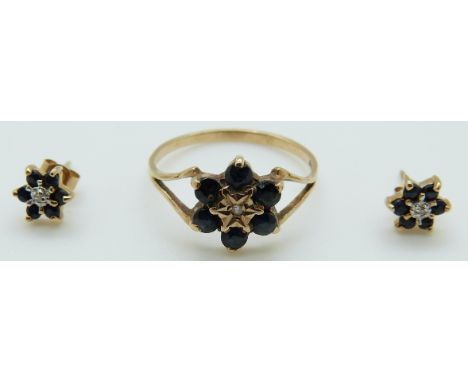 A 9ct gold ring set with a diamond and sapphires and similar earrings 