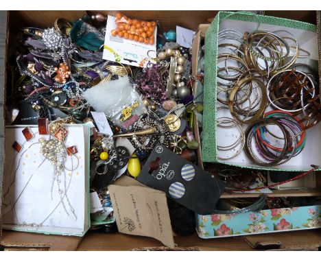 A large collection of costume jewellery including agate beads, tiger's eye pendants, fossil pendant, rose quartz pendant, whi