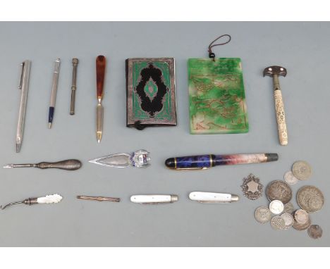 A small collection of hallmarked silver and bijouterie including a Victorian notebook with white metal cover, propelling penc