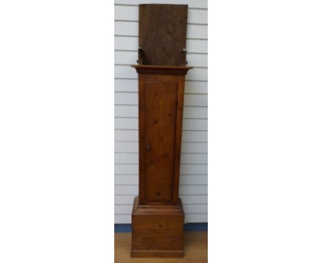 A pine 19thC longcase clock case with pendulum