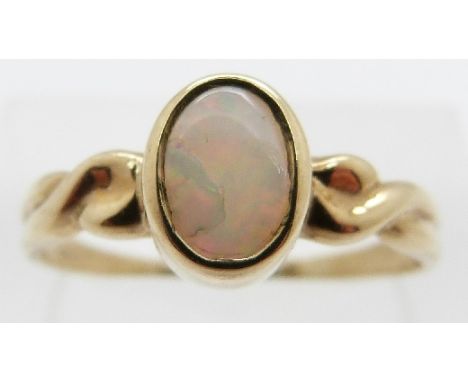 A 9ct gold ring set with an opal, size Q/R, 1.7g. 