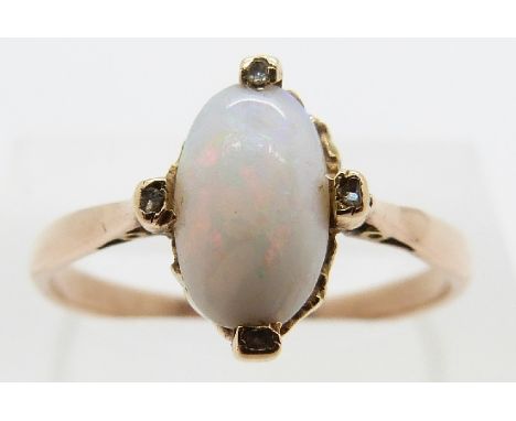 A 9ct gold ring set with an opal and four diamonds, size R/S, 2.3g 