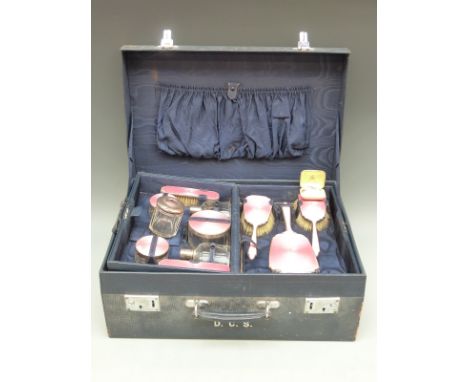 George VI hallmarked silver and pink guilloché enamel ladies travelling set comprising 10 pieces, London 1940 in blue leather
