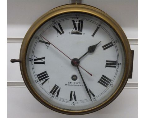 Smiths, Cricklewood, NW2 ship's brass 8-day bulkhead clock with enamelled 160mm Roman dial with Arabic minutes, black spade h