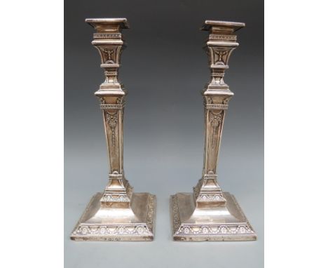 A pair of hallmarked silver Victorian neoclassical style candlesticks, London 1874 maker Henry Wilkinson, 32.5cm tall 