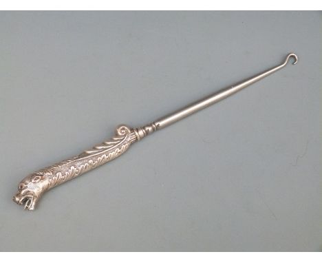 Victorian hallmarked silver-handled novelty button hook, the handle with Rococo swags and lion head set with garnet eyes, Bir