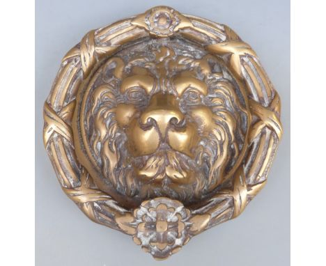 A large brass lion mask door knocker, maximum diameter 25.5cm, 3.8kg