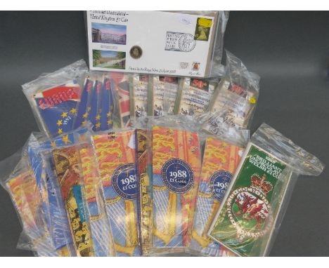 A collection of brilliant uncirculated etc 50 pence and £1 coins in collectors' packs includes two first day cover examples, 