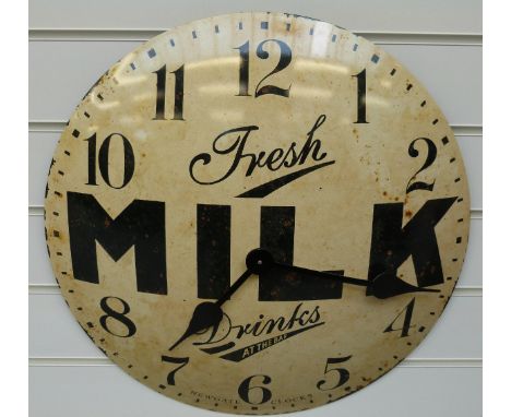 A caseless quartz dial wall clock with 'Fresh Milk Drinks at the Bar' advertising slogan to the distressed finish convex enam