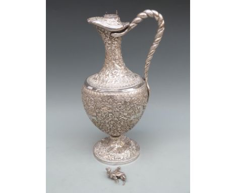 Kutch Indian white metal ewer with embossed decoration inlcluding boar, deer, bear and lion hunting, with camel finial and ha