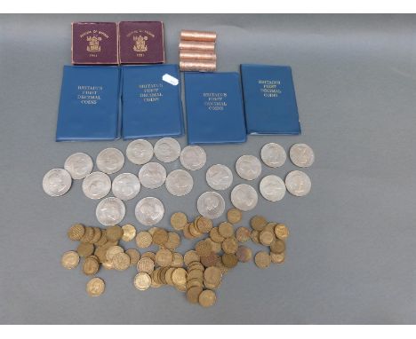 A collection of modern crowns to include Festival of Britain, Churchill, together with first decimal sets, four rolls of unci