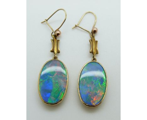 A pair of Victorian earrings set with black opal doublets with pierced backs 