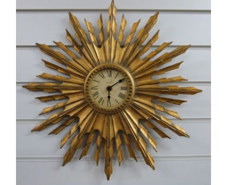 Newgate London quartz sunburst wall clock with distressed look Roman dial, overall diameter 47cm