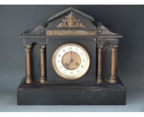 A Marti 19thC French slate mantel clock with Romanesque classical case, reeded columns and acanthus leaved capitols, the arch