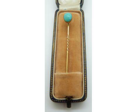 A Victorian stick pin set with a turquoise cabochon 