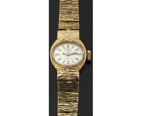 Rotary 9ct gold ladies wristwatch with two-tone gold and black hands and baton markers, silver face and signed 21 jewel movem