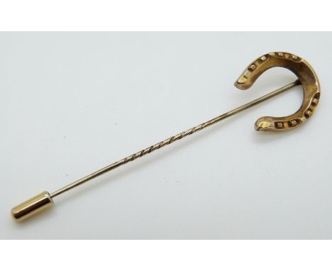 A Victorian stick pin set in the form of a horseshoe