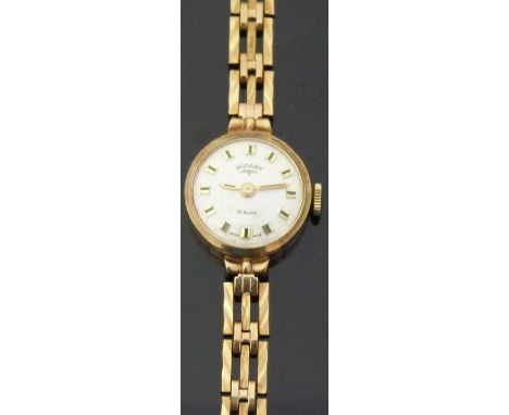 Rotary 9ct gold ladies wristwatch with two-tone hands and markers, silver face and signed 21 jewel movement on 9ct gold brace