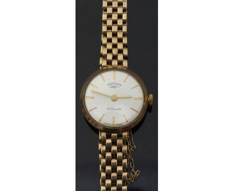 Rotary 9ct gold ladies wristwatch with gold hands and baton markers, silver face and 21 jewel movement on 9ct gold bracelet, 