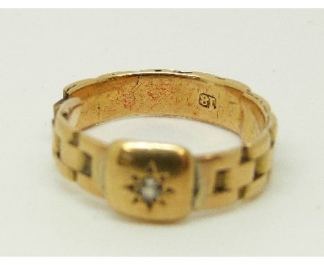 An 18ct gold Victorian ring set with a diamond in a star setting, 3.4g 