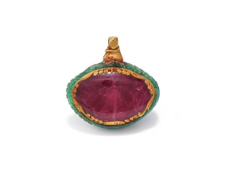 AN ANTIQUE INDIAN RUBY AND CARVED EMERALD PENDANT  The oval polished ruby within a scrolled gold border, set into a carved em