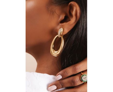 CARTIER, A PAIR OF DIAMOND SET EARRINGS CIRCA 1980  Each tapered bombé surmount set with graduated brilliant cut diamonds, su