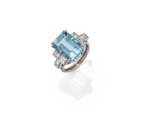 A MID 20TH CENTURY AQUAMARINE AND DIAMOND RING The rectangular step cut aquamarine with canted corners, between rectangular c
