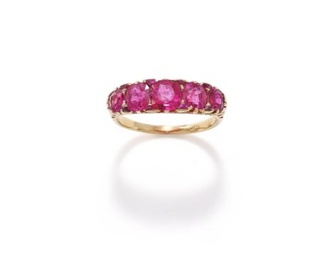 A LATE 19TH CENTURY RUBY FIVE STONE RING The five graduated cushion shaped rubies with triangular cut rubies between, to a pi