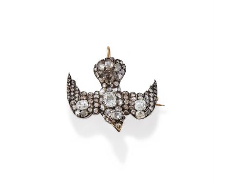 A LATE 19TH CENTURY DIAMOND SET DOVE BROOCH/PENDANT CIRCA 1880 The dove with outstretched wings, set with various shaped old 