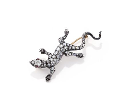 A LATE VICTORIAN SALAMANDER BROOCH  CIRCA 1880  The gold backed silver lizard set with graduated rose cut diamonds to an old 
